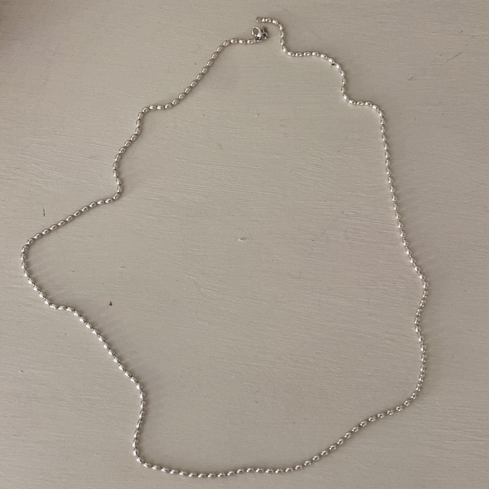 Pandoras long sterling silver chain. Please note charm not included